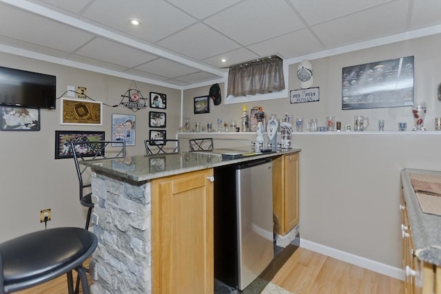 83 Chalmers St, Springfield, MA 01118 - kitchen featuring light wood-style flooring, a drop ceiling, light stone counters, recessed lighting, and fridge