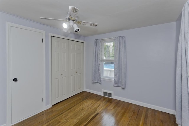 83 Chalmers St, Springfield, MA 01118 - unfurnished bedroom featuring baseboards, wood finished floors, a closet, and a ceiling fan