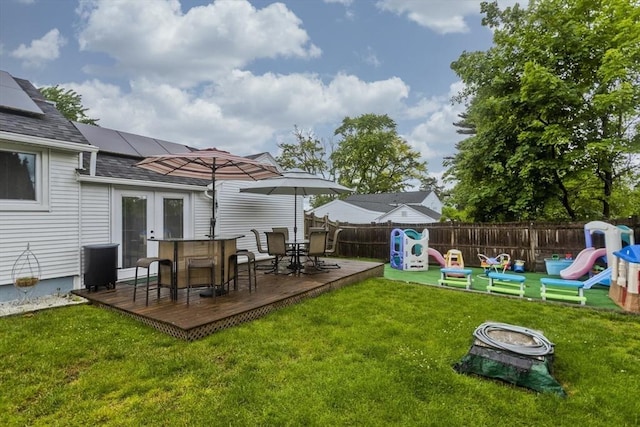 83 Chalmers St, Springfield, MA 01118 - view of yard with a playground, french doors, a fire pit, and a wooden deck