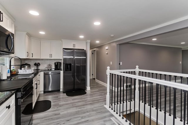 83 Chalmers St, Springfield, MA 01118 - kitchen featuring black appliances, backsplash, baseboards, white cabinets, and recessed lighting