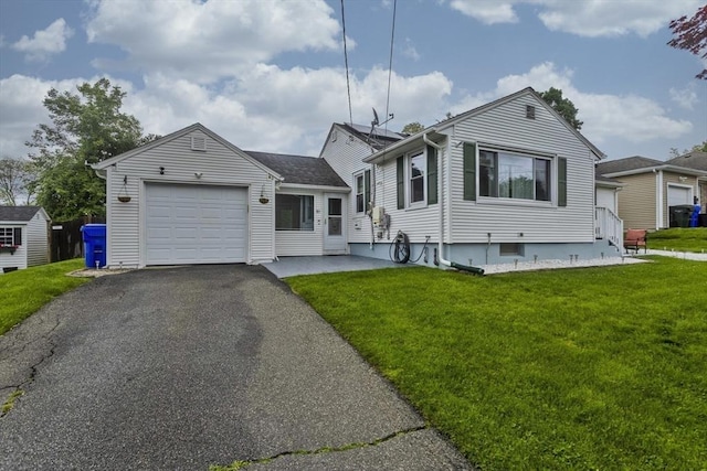 83 Chalmers St, Springfield, MA 01118 - single story home featuring an attached garage, a front lawn, asphalt driveway, and a storage shed