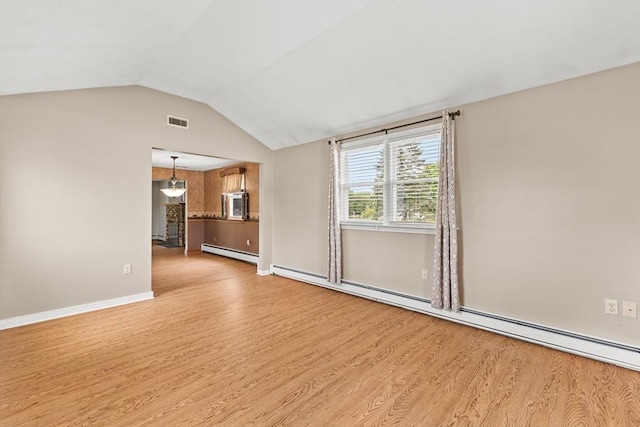 171 Duffy Dr, Taunton, MA 02780 - unfurnished living room featuring baseboard heating, a baseboard heating unit, light wood-type flooring, vaulted ceiling, and baseboards