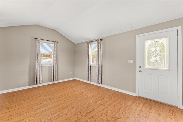 171 Duffy Dr, Taunton, MA 02780 - foyer with light wood-type flooring, vaulted ceiling, and baseboards