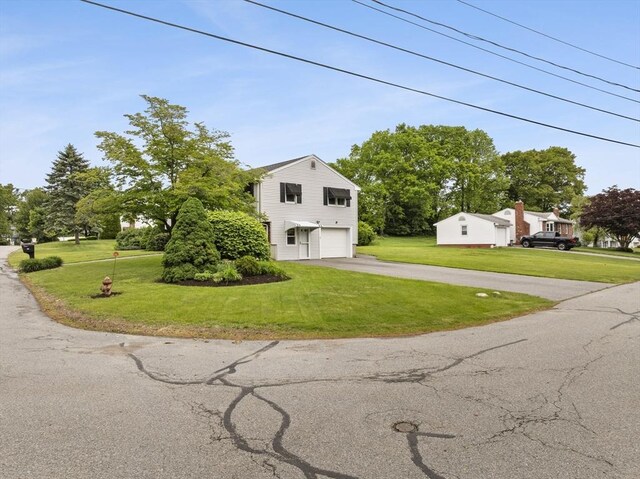 171 Duffy Dr, Taunton, MA 02780 - view of front of property with asphalt driveway, a garage, and a front lawn