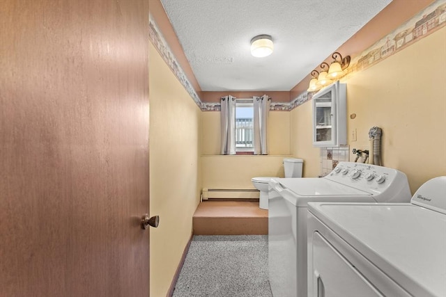 171 Duffy Dr, Taunton, MA 02780 - laundry area featuring a baseboard heating unit, separate washer and dryer, a textured ceiling, and baseboards