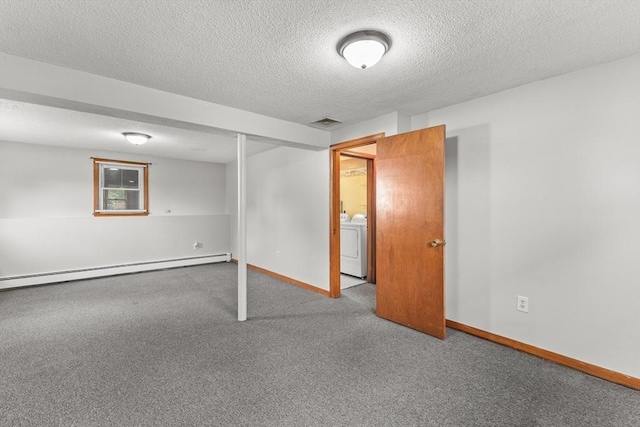 171 Duffy Dr, Taunton, MA 02780 - below grade area featuring baseboard heating, carpet, a textured ceiling, washer / clothes dryer, and baseboards