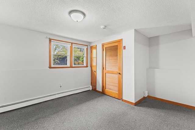 171 Duffy Dr, Taunton, MA 02780 - unfurnished bedroom featuring a baseboard radiator, a textured ceiling, carpet, baseboards, and a closet