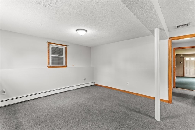 171 Duffy Dr, Taunton, MA 02780 - empty room with a baseboard heating unit, carpet flooring, a textured ceiling, and baseboards