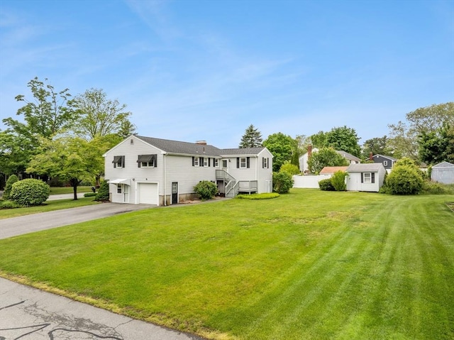 171 Duffy Dr, Taunton, MA 02780 - view of front facade featuring driveway, an attached garage, and a front yard