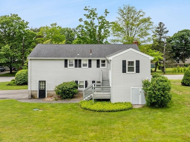 171 Duffy Dr, Taunton, MA 02780 - view of front of home with a chimney, a front yard, and stairs