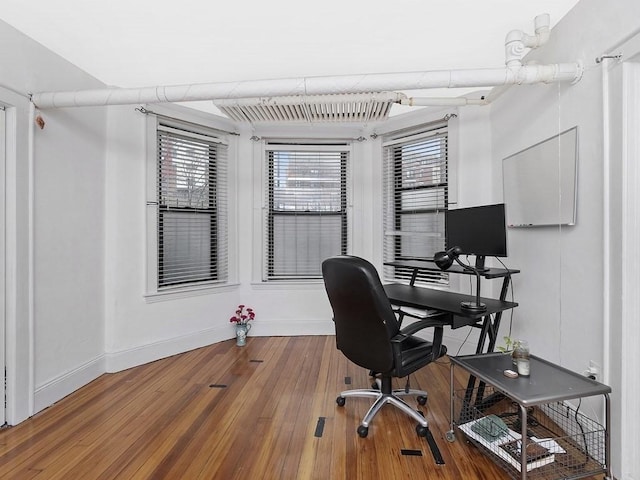 office featuring wood finished floors and baseboards