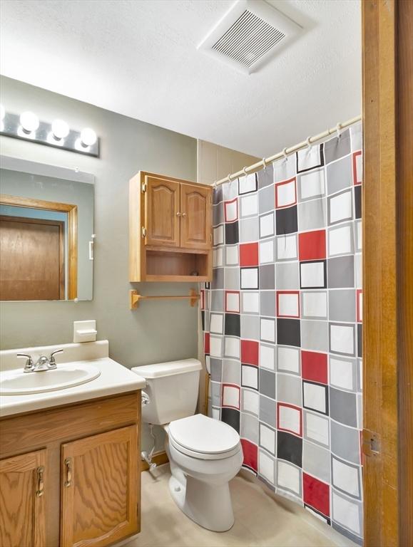 18 Sharron Dr Unit 18, Easton, MA 02375 - bathroom featuring vanity and a shower with curtain