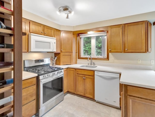 18 Sharron Dr Unit 18, Easton, MA 02375 - kitchen with white appliances, light countertops, and brown cabinetry