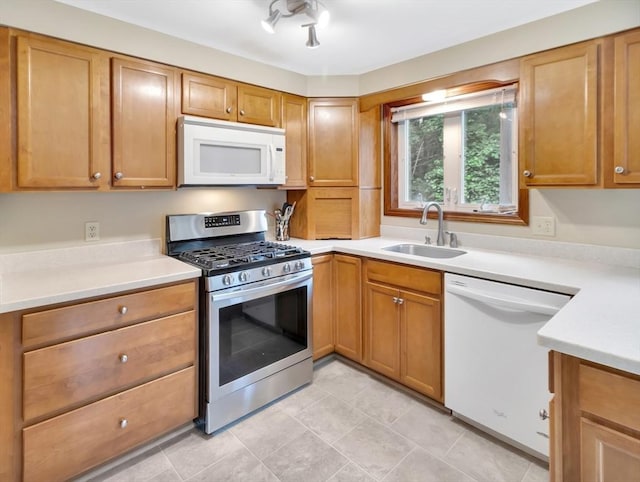 18 Sharron Dr Unit 18, Easton, MA 02375 - kitchen with white appliances, light countertops, and brown cabinets