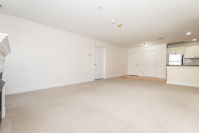 8 Crowninshield Unit 312, Peabody, MA 01960 - unfurnished living room featuring light carpet, a fireplace, ornamental molding, baseboards, and recessed lighting