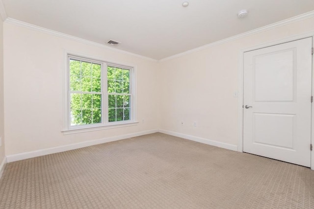 8 Crowninshield Unit 312, Peabody, MA 01960 - empty room featuring baseboards, crown molding, a smoke detector, and light carpet
