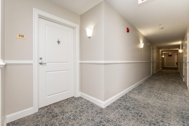 8 Crowninshield Unit 312, Peabody, MA 01960 - hallway featuring carpet floors and baseboards