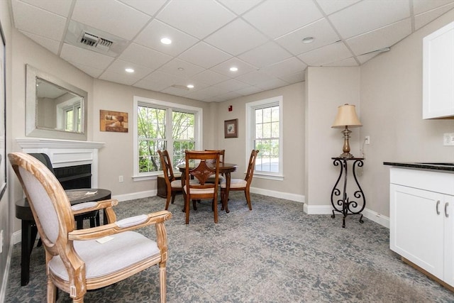 8 Crowninshield Unit 312, Peabody, MA 01960 - carpeted dining area with a paneled ceiling, baseboards, recessed lighting, and a fireplace