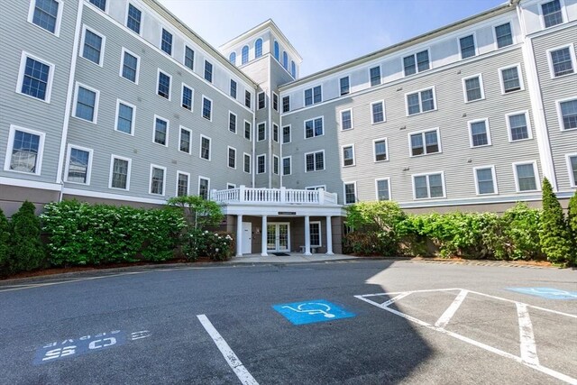 8 Crowninshield Unit 312, Peabody, MA 01960 - view of building exterior featuring uncovered parking