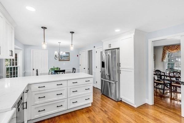5 Hickory Rd, Southborough, MA 01772 - kitchen with high end refrigerator, plenty of natural light, a peninsula, a chandelier, and recessed lighting