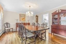 5 Hickory Rd, Southborough, MA 01772 - dining area with a chandelier, wood finished floors, and ornamental molding
