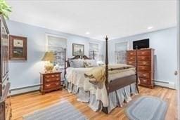 5 Hickory Rd, Southborough, MA 01772 - bedroom featuring a baseboard heating unit, wood finished floors, baseboard heating, and recessed lighting