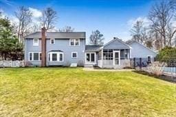 5 Hickory Rd, Southborough, MA 01772 - rear view of property with a sunroom and a chimney