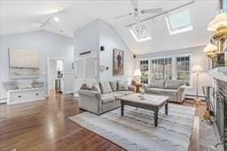 5 Hickory Rd, Southborough, MA 01772 - living room featuring a skylight, ceiling fan, high vaulted ceiling, and wood finished floors