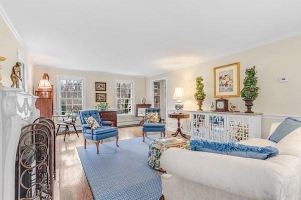 5 Hickory Rd, Southborough, MA 01772 - living room with ornamental molding, wood finished floors, and a baseboard radiator