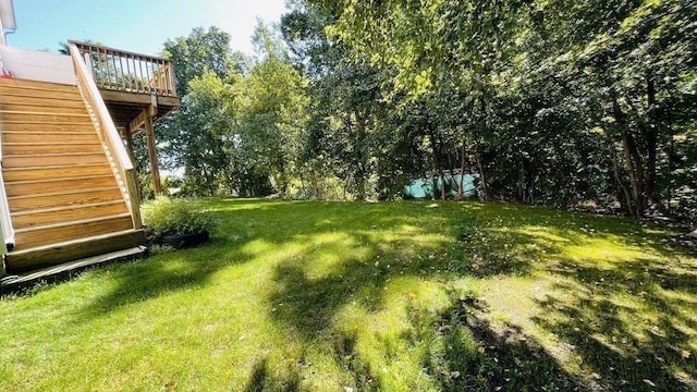 27 Christine Dr, Worcester, MA 01604 - view of green lawn with stairs and a wooden deck