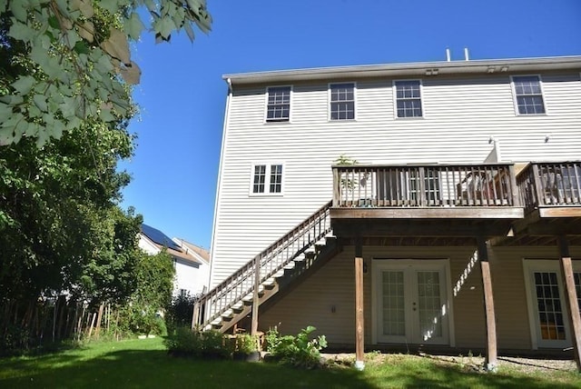 27 Christine Dr, Worcester, MA 01604 - back of house featuring stairway, a deck, and a lawn