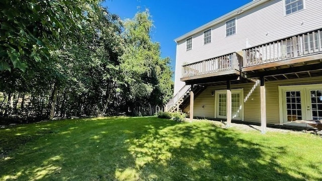 27 Christine Dr, Worcester, MA 01604 - back of house with a deck, a lawn, and stairway