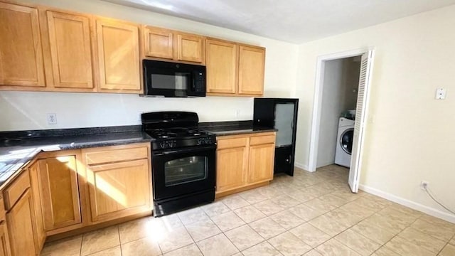 27 Christine Dr, Worcester, MA 01604 - kitchen with black appliances, dark countertops, washer / dryer, and light tile patterned floors