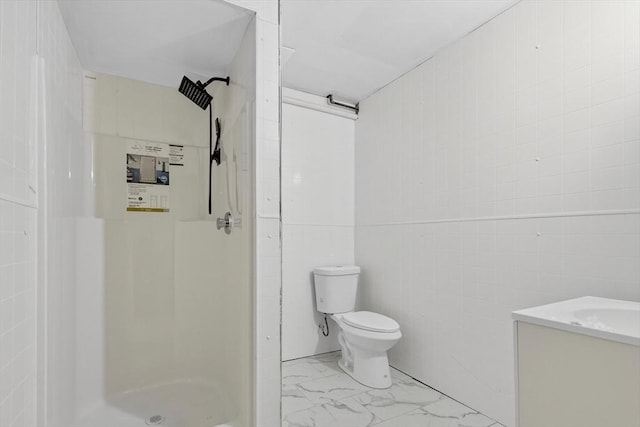 27 Christine Dr, Worcester, MA 01604 - bathroom featuring a stall shower, marble finish floors, vanity, and tile walls