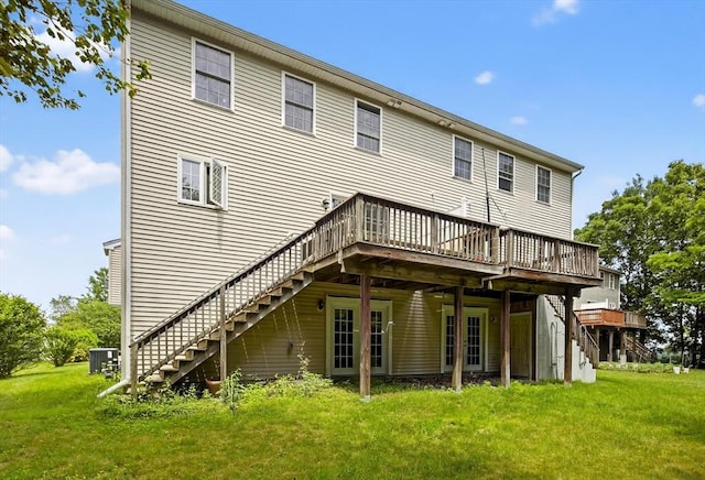 27 Christine Dr, Worcester, MA 01604 - back of house featuring stairs, a wooden deck, and a lawn