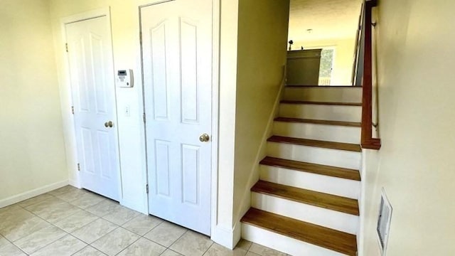 27 Christine Dr, Worcester, MA 01604 - stairs featuring tile patterned floors and baseboards