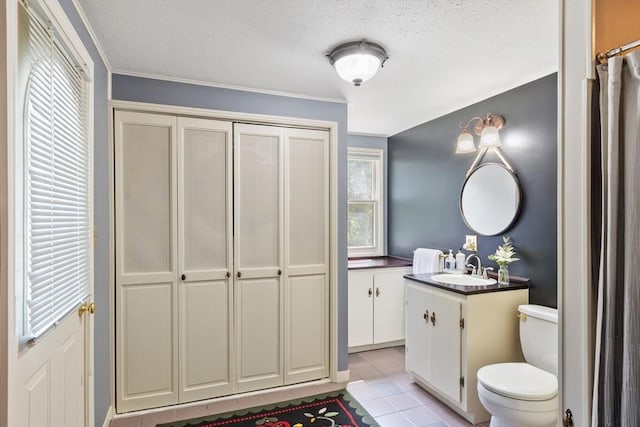 18 Mann St, Bellingham, MA 02019 - full bath featuring vanity, a textured ceiling, tile patterned flooring, and crown molding