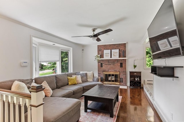 18 Mann St, Bellingham, MA 02019 - living area with baseboard heating, a ceiling fan, healthy amount of natural light, wood finished floors, and crown molding