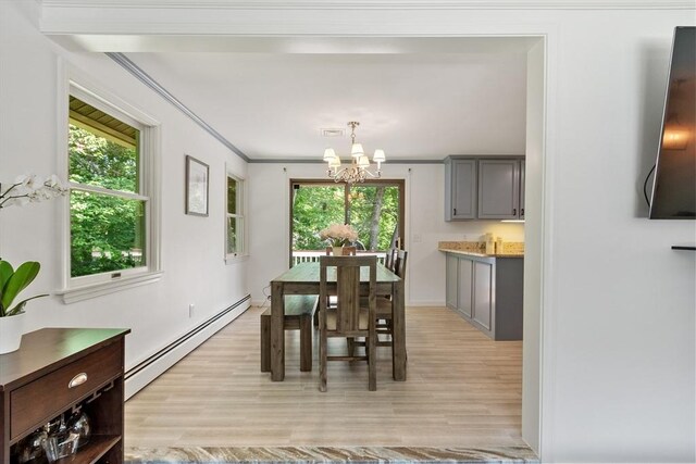 18 Mann St, Bellingham, MA 02019 - dining room featuring a baseboard heating unit, a chandelier, light wood-style flooring, and crown molding