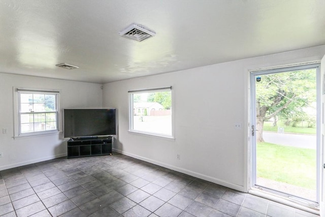 15 Fredette St, Springfield, MA 01109 - unfurnished living room with tile patterned floors