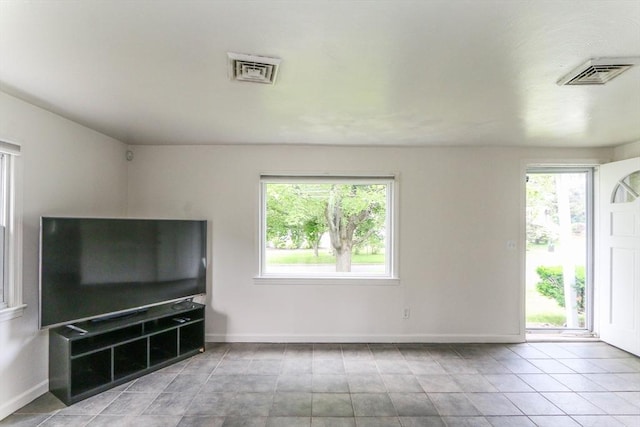 15 Fredette St, Springfield, MA 01109 - unfurnished living room featuring plenty of natural light and light tile patterned floors