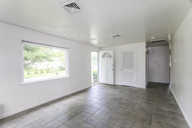 15 Fredette St, Springfield, MA 01109 - unfurnished room with baseboards and dark tile patterned flooring