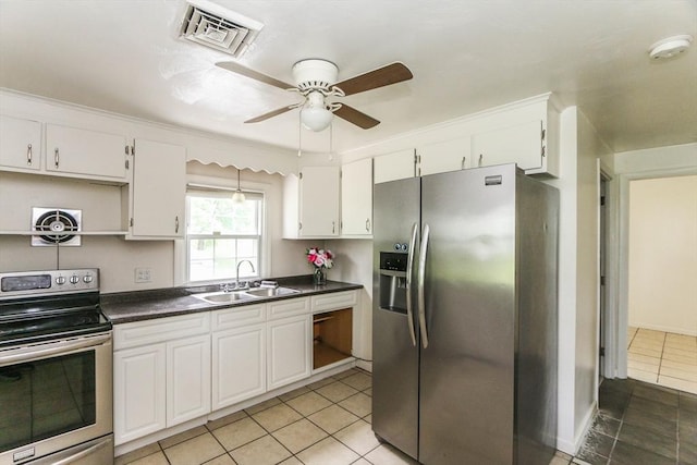 15 Fredette St, Springfield, MA 01109 - kitchen with appliances with stainless steel finishes, white cabinets, and dark countertops