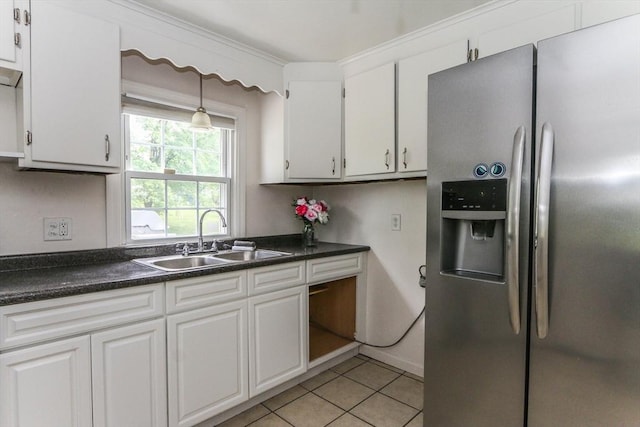 15 Fredette St, Springfield, MA 01109 - kitchen featuring stainless steel fridge, white cabinets, light tile patterned floors, and dark countertops