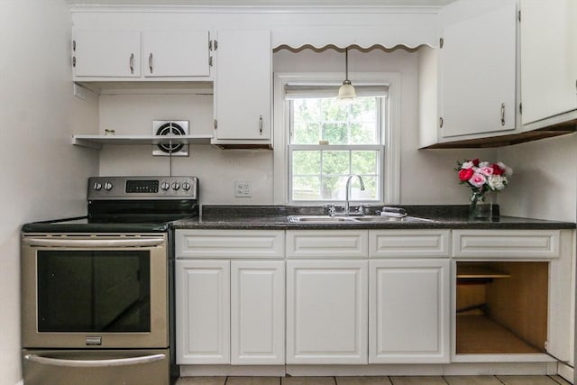 15 Fredette St, Springfield, MA 01109 - kitchen with stainless steel electric stove, open shelves, white cabinetry, and dark countertops