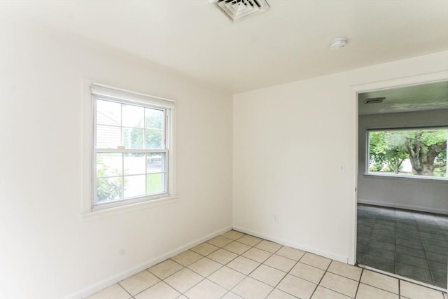 15 Fredette St, Springfield, MA 01109 - empty room featuring a smoke detector and light tile patterned floors