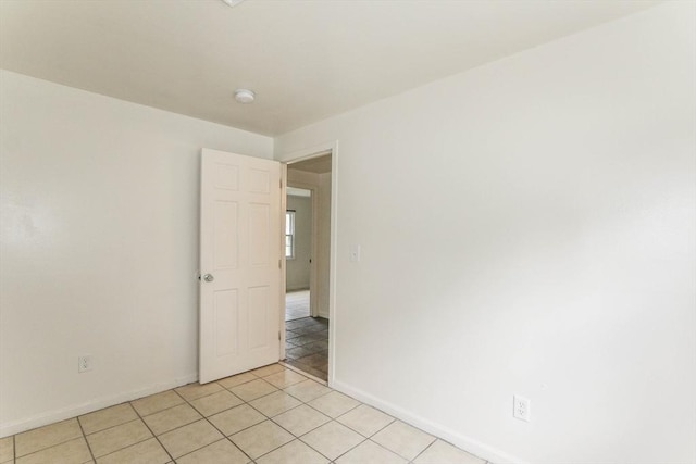 15 Fredette St, Springfield, MA 01109 - spare room featuring light tile patterned flooring and a smoke detector