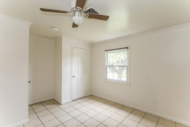 15 Fredette St, Springfield, MA 01109 - unfurnished bedroom featuring crown molding, ceiling fan, light tile patterned floors, and a closet