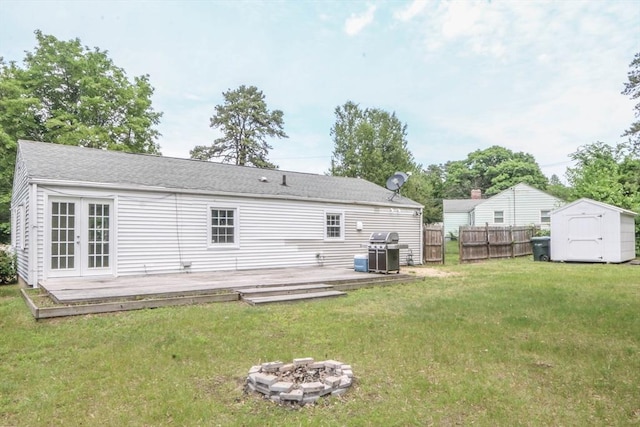 15 Fredette St, Springfield, MA 01109 - back of house with a storage shed, a deck, french doors, and a fire pit