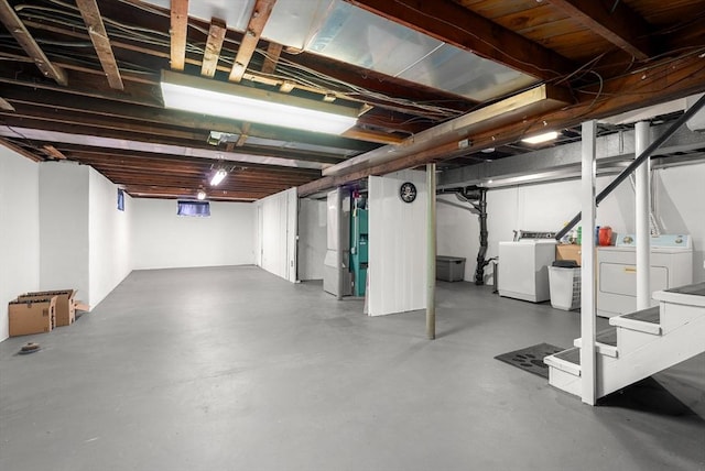 finished below grade area featuring washer and clothes dryer and stairway